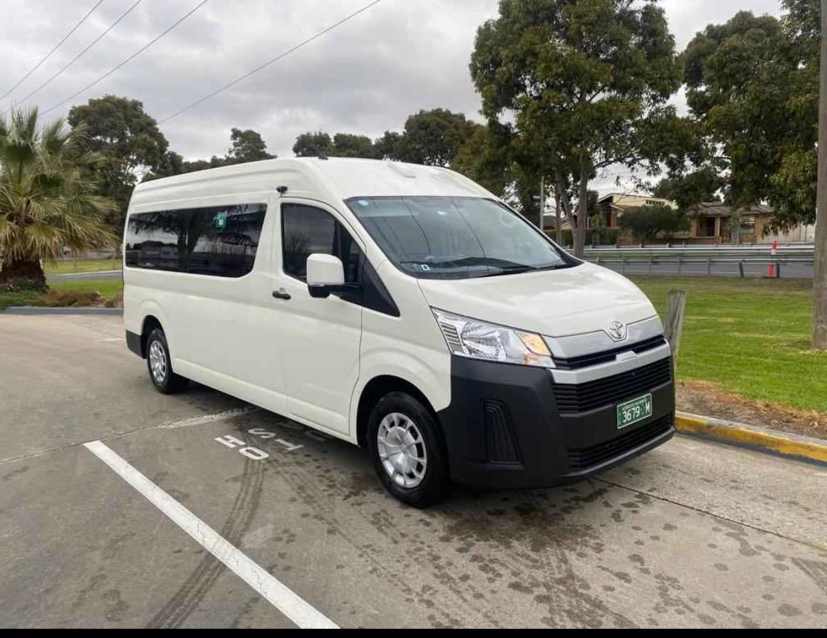 White maxi taxi van with wheelchair lift